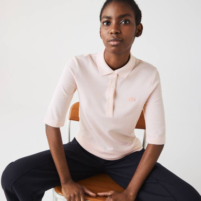 Жени Lacoste светло розово прилепнало еластично памучно поло облекло XTV622514