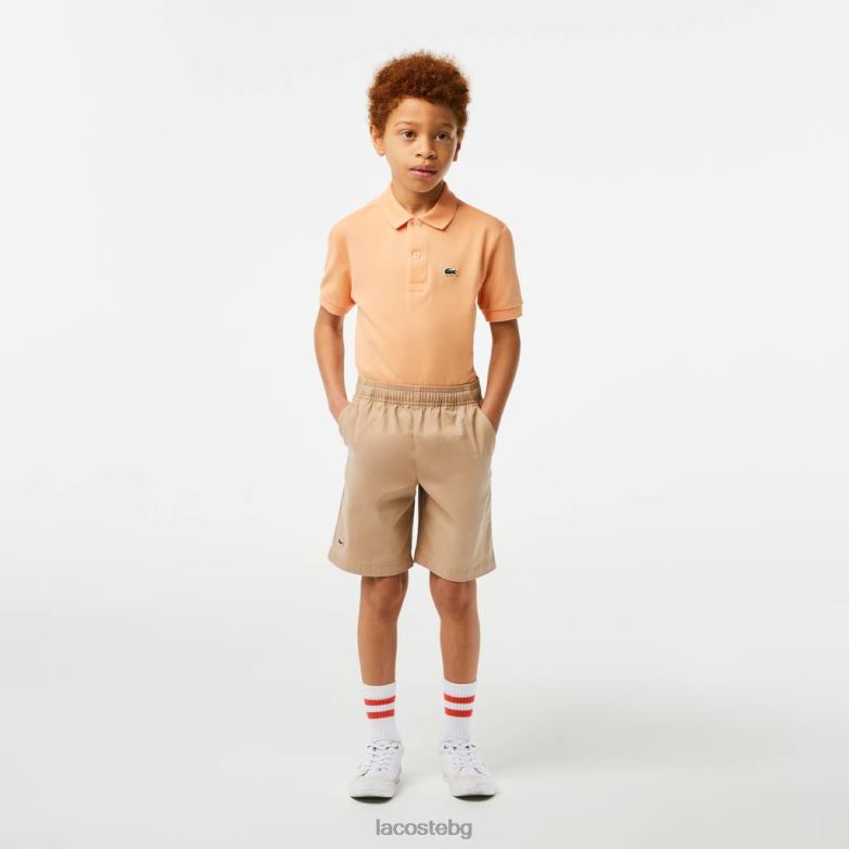 деца Lacoste бежово олекотени памучни габардинени бермуди облекло XTV623107