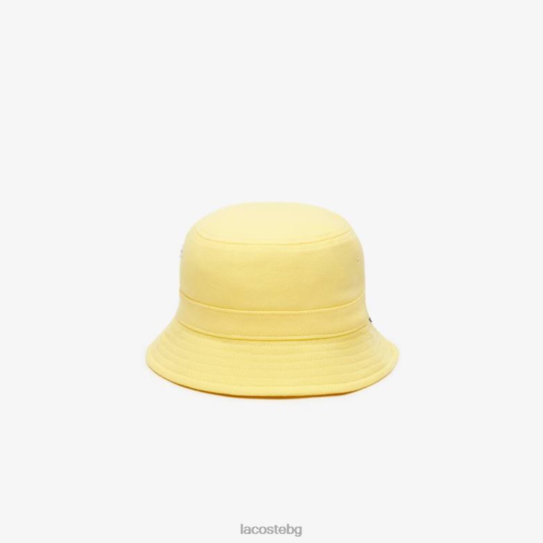 унисекс Lacoste жълто шапка-кофа от органичен памук аксесоари XTV622165